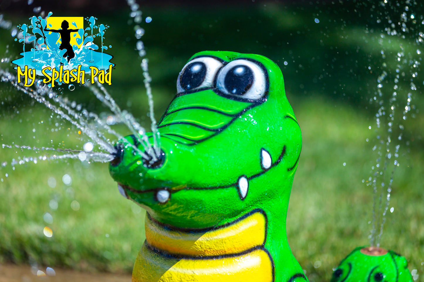 Alligator splash pad water play feature spraying water streams, fun portable sprinkler for kids in backyard.