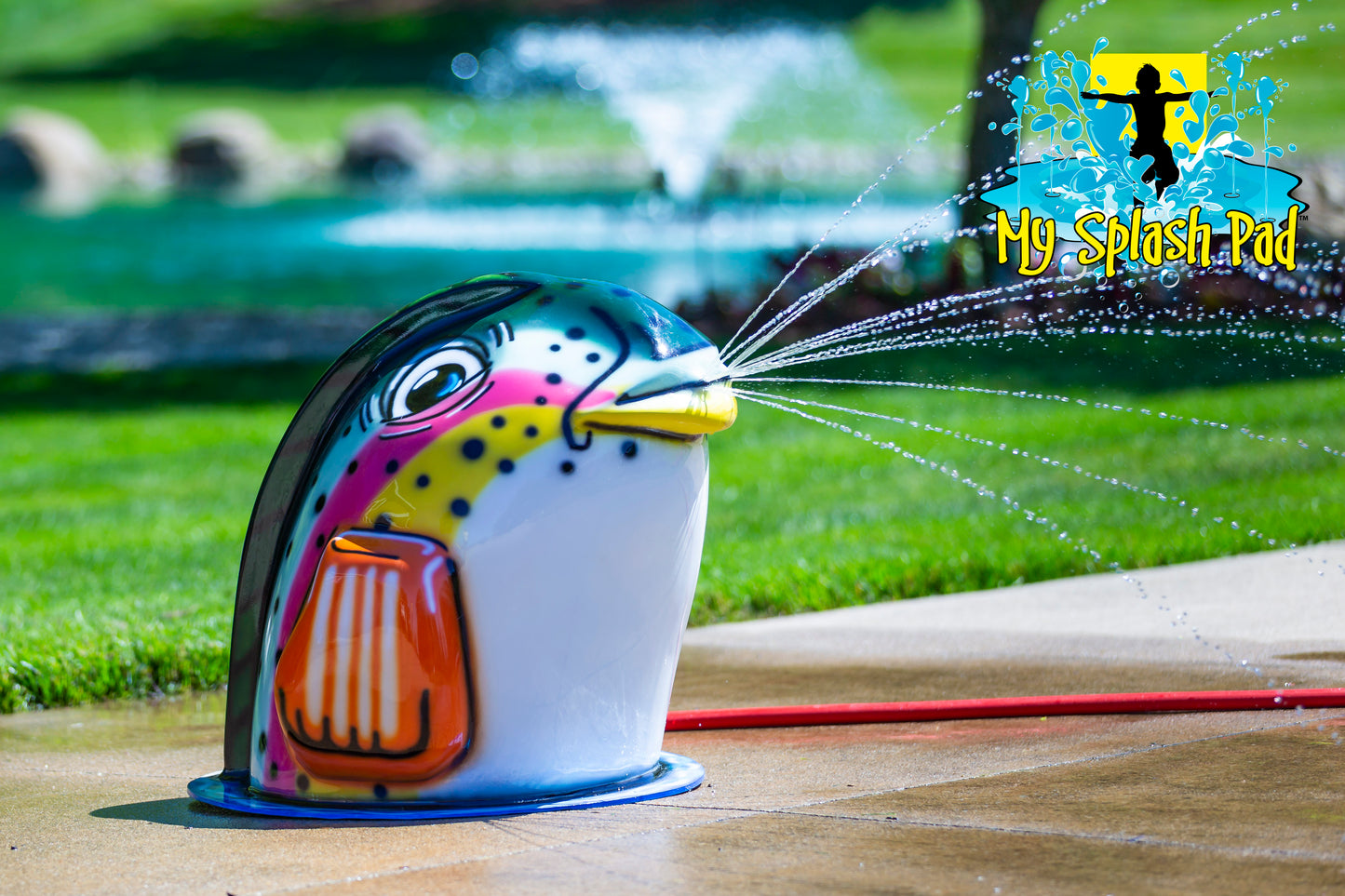 Fish Mobile Spray and Play Features – colorful rainbow trout splash pad water play structure spraying water from its mouth.