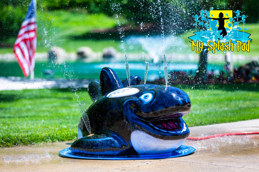 Orca Mobile Spray and Play Feature by My Splash Pad – black and white orca-shaped splash pad structure spraying water streams for interactive outdoor fun.