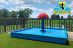 Portable Kid Wading Pool Kit by My Splash Pad with red mushroom water feature and blue splash basin on artificial turf deck.