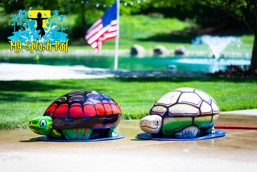 Medium Turtle Spray and Play Feature by My Splash Pad – interactive turtle splash pad water play structure spraying streams of water at an outdoor park.